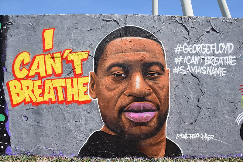 A mural on George Floyd showing his portrait and his last words I can't breath during torture in police custody