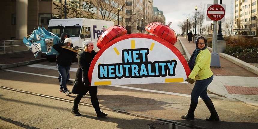 Rally organizers carry away props following a protest outside the Federal Communication Commission building against the end of net neutrality rules on December 14, 2017 in Washington.Chip Somodevilla / Getty Images